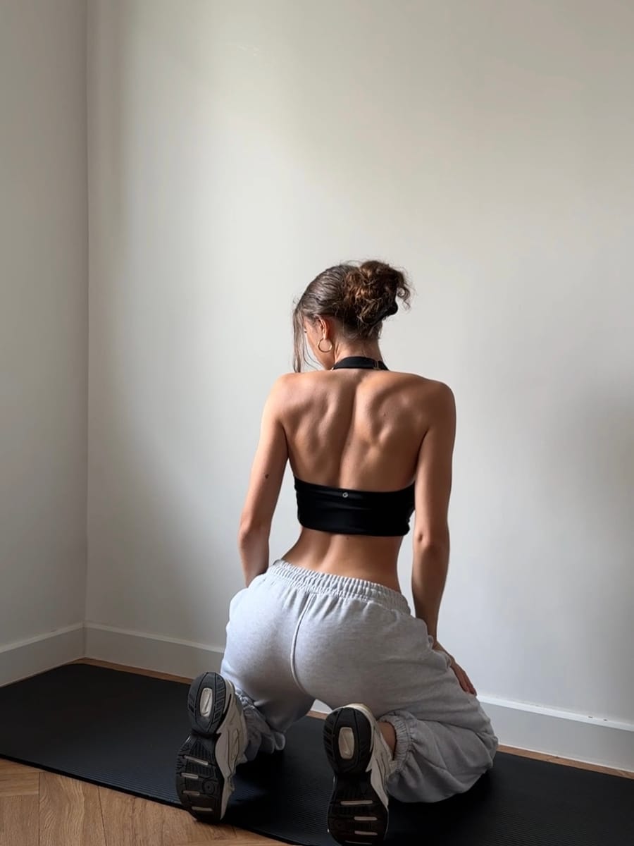 Alina training on a mat at home